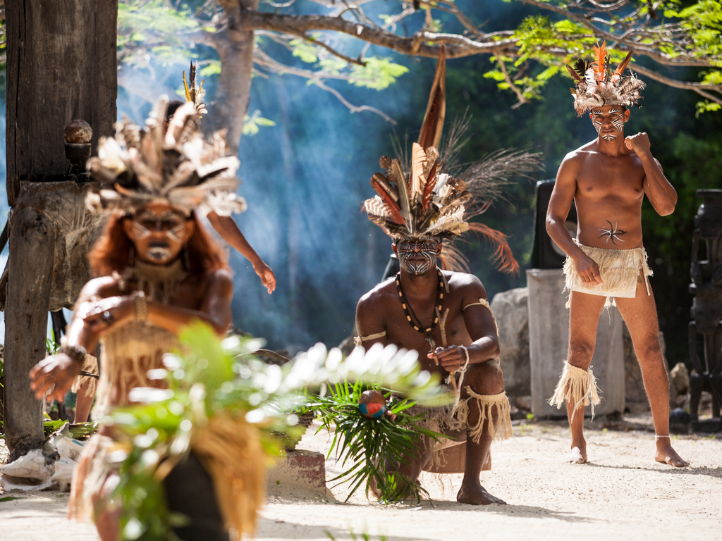 Dancers in Bavarp cultural show at Manti Park, Punta Cana, Dominican Republic. In times past sight of their warrior paint might have warded off sailors believing it was not safe to travel to the Caribbean