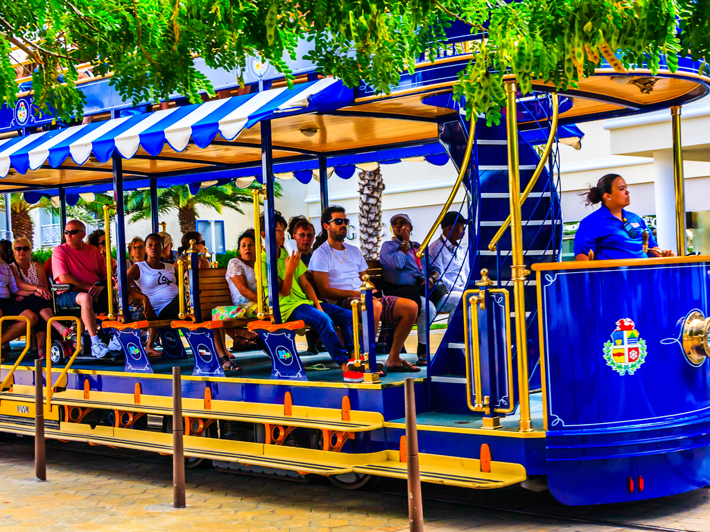 A group of tourists on a tram car in Aruba