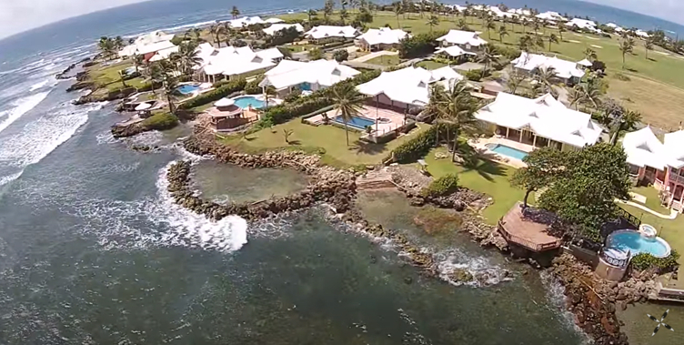 An aerial view of several private villas for rent which line the Atlantic coast on the Tobago Plantations Estate, Tobago